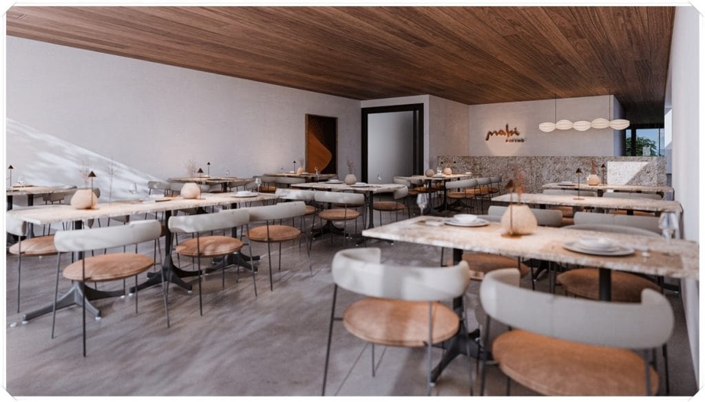 Interior de um restaurante com mesas e cadeiras modernas, paredes claras e detalhes em madeira, criando uma atmosfera elegante e acolhedora.