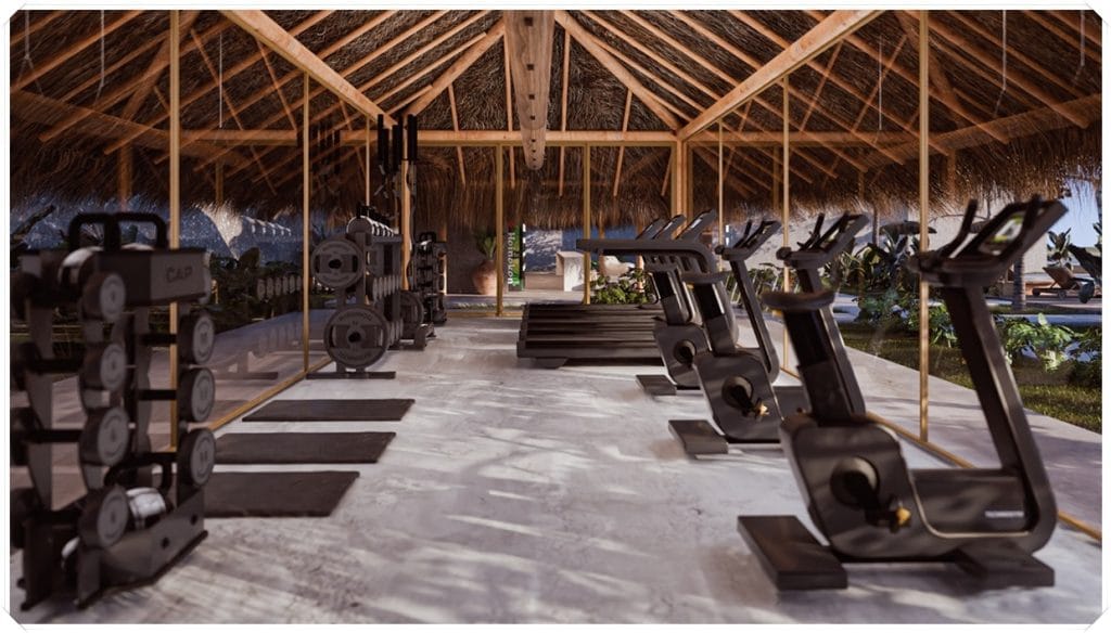Academia com equipamentos de musculação, piso claro, estrutura de palha no teto e vista para áreas externas com plantas.