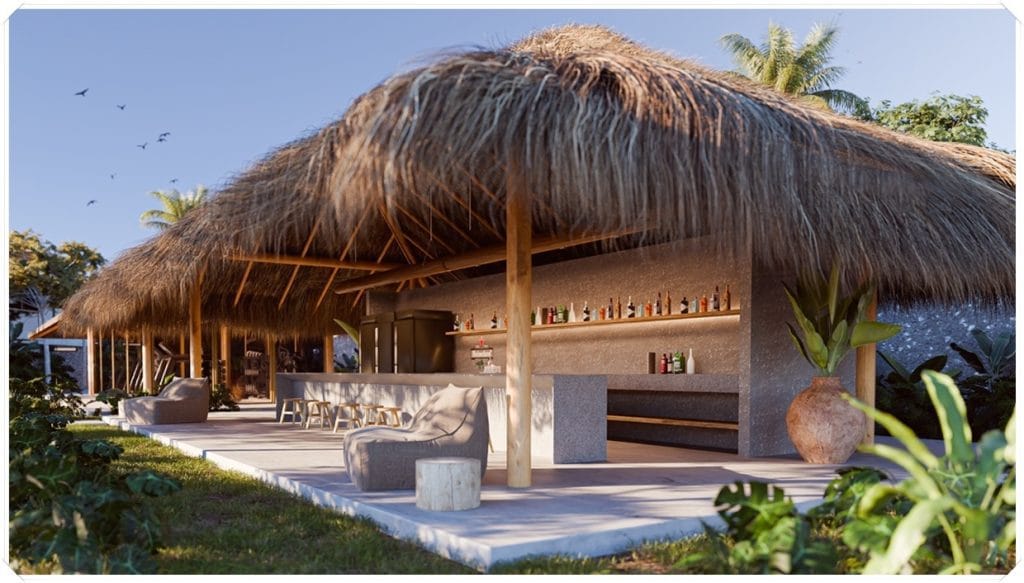 Bar com cobertura de palha, mesas e cadeiras ao ar livre, cercado por vegetação tropical e uma estética acolhedora.