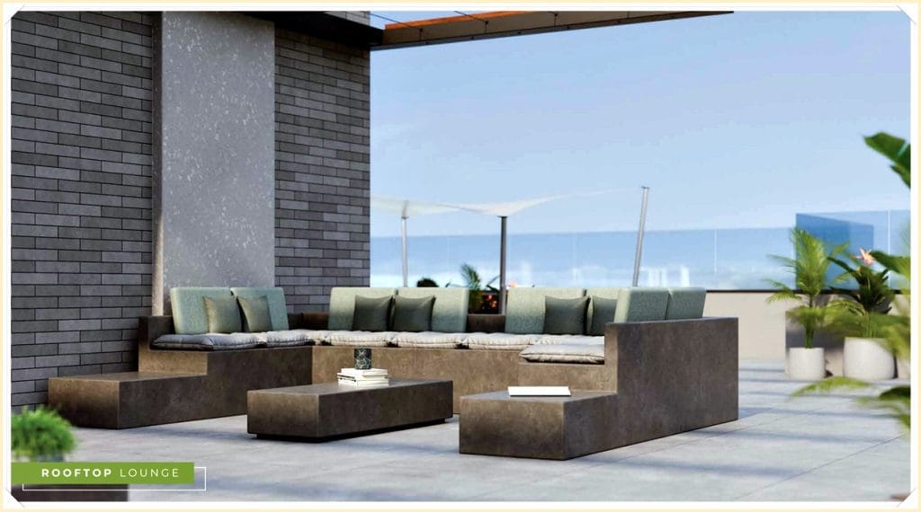 Lounge no rooftop com sofás em tons neutros, mesas baixas de concreto e plantas decorativas, com vista ao fundo.