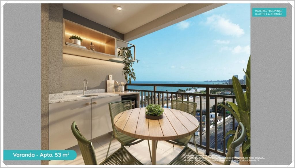 Varanda de apartamento com vista para o mar, mesa e cadeiras verdes, área de churrasqueira e decoração moderna em tons neutros.